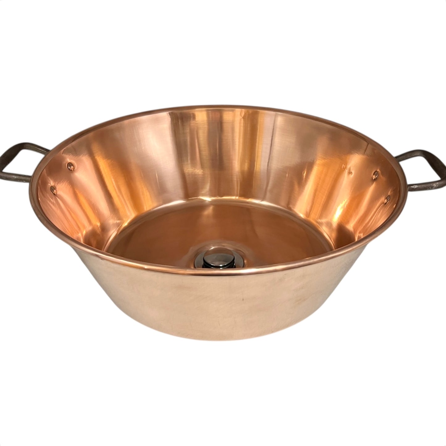 French copper bowl upcycled into a copper sink with iron handles and a chrome pop up waste on a white background