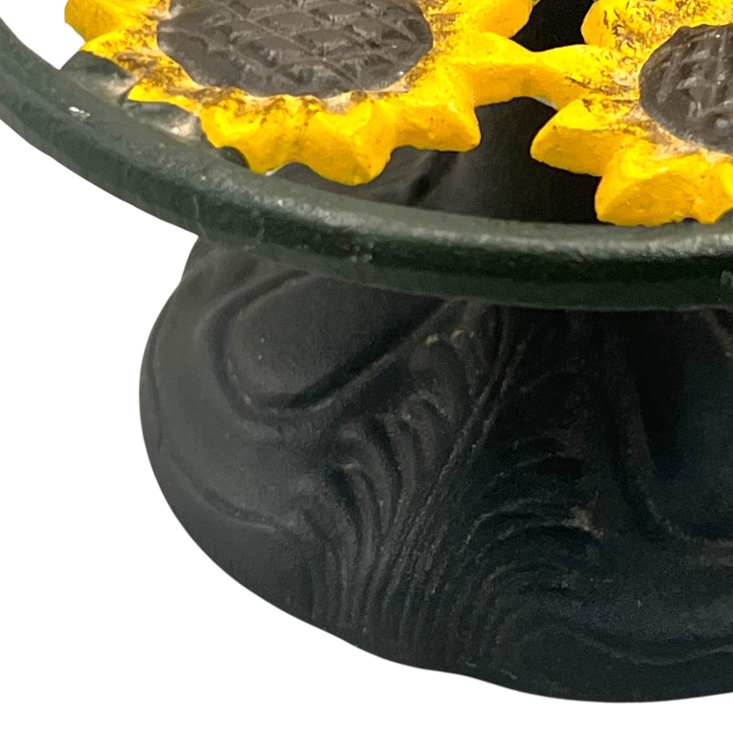 Close-up of a sunflower decoration on a kitchen paper towel stand on a white background