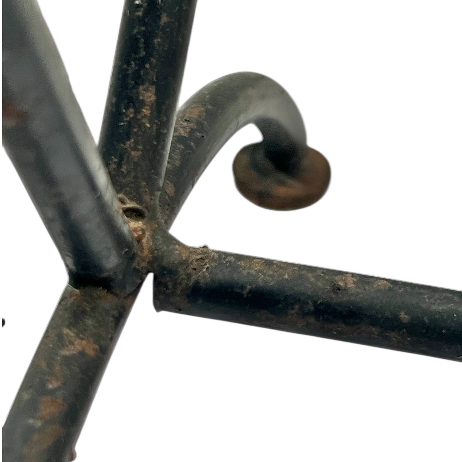 Close-up of a black metal stand on a white background