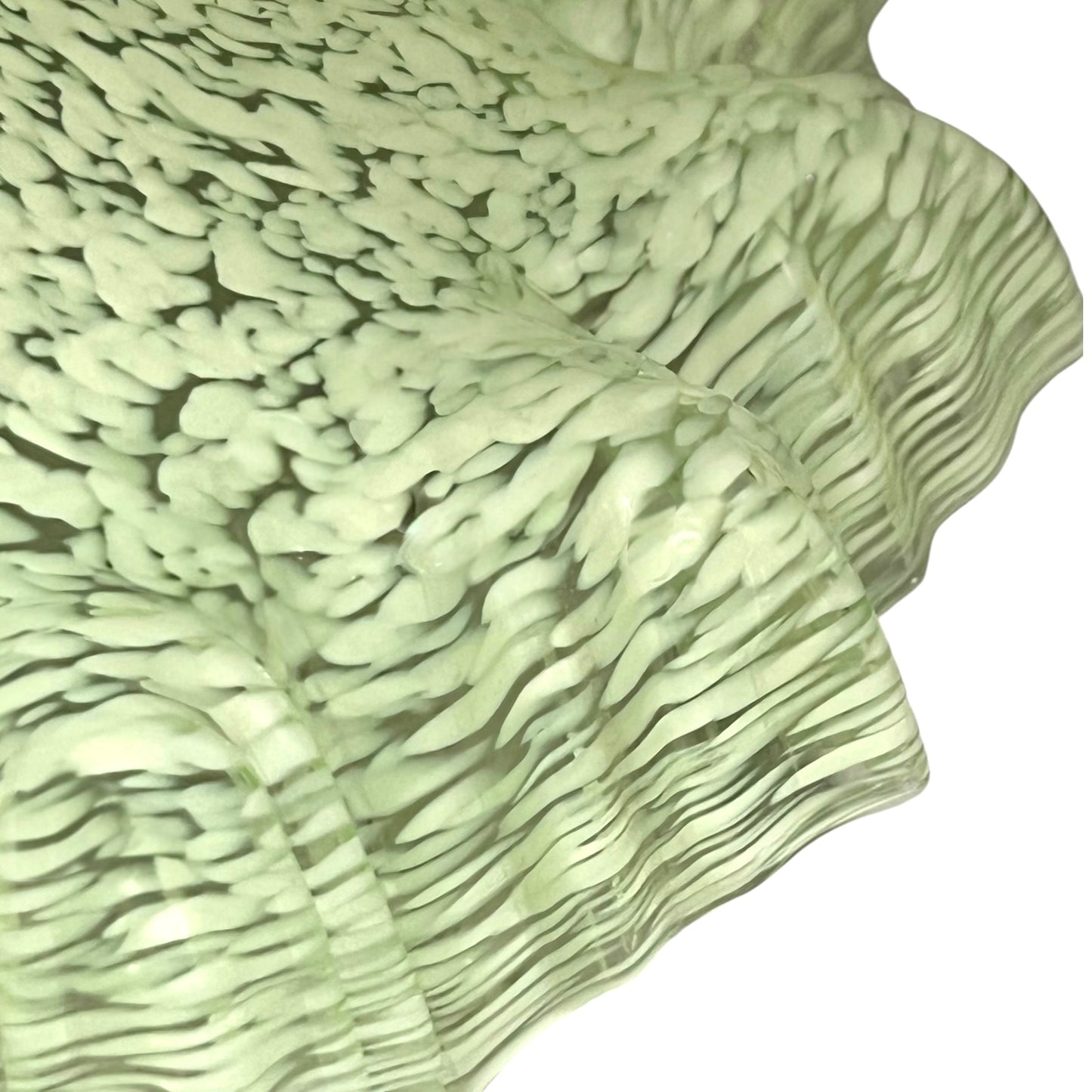 close up of light green milk glass pendant shade on a white background