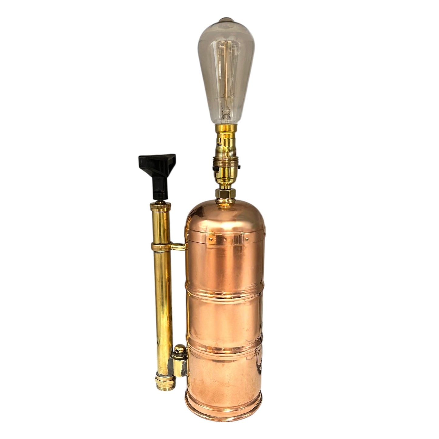 Copper and brass lamp with vintage design on a white background