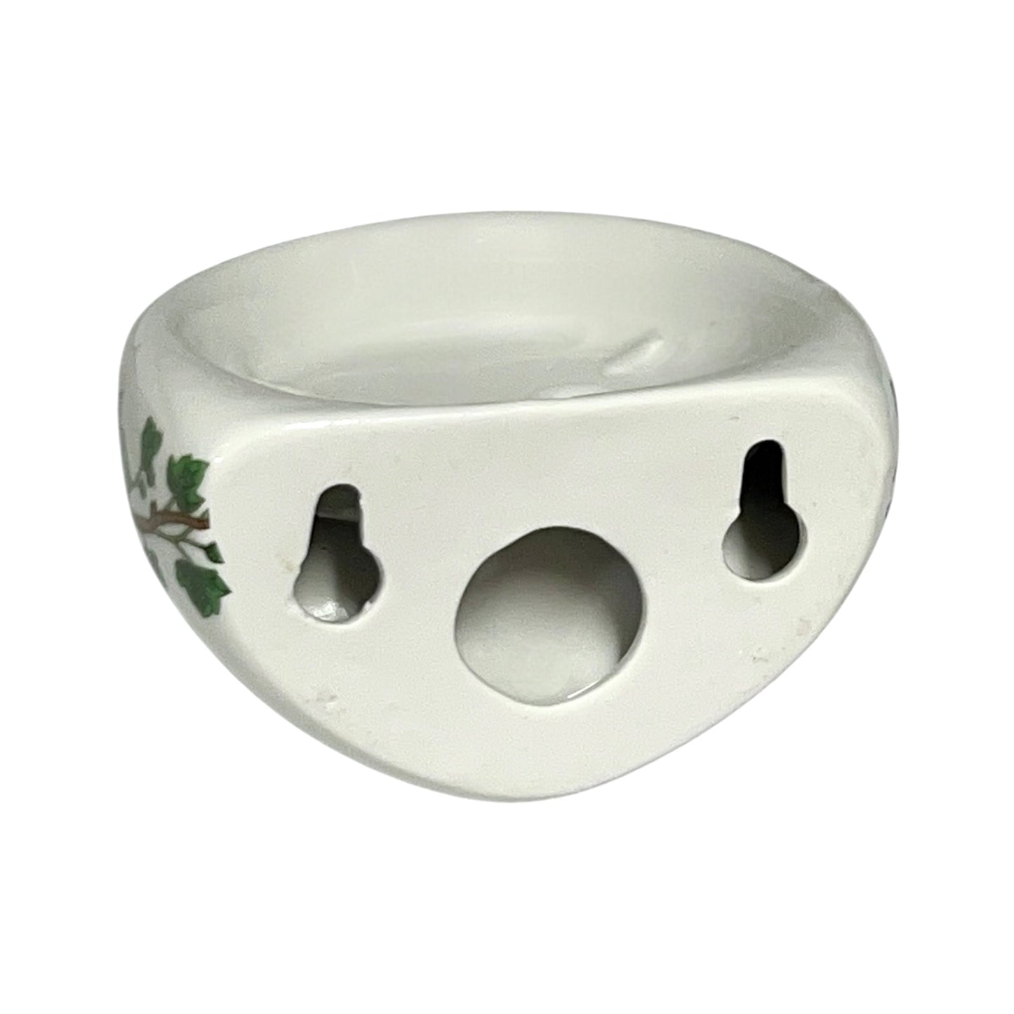 Porcelain bathroom toothbrush holder featuring green leaf patterns on a white background