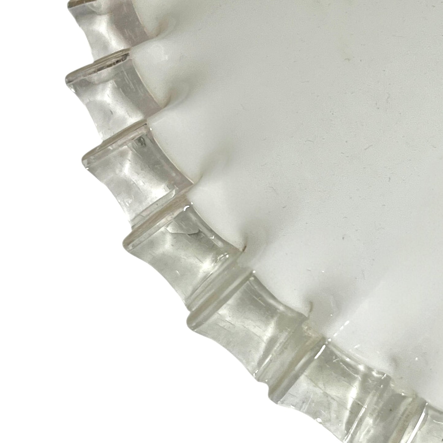 close up of lampshade rim on a white background