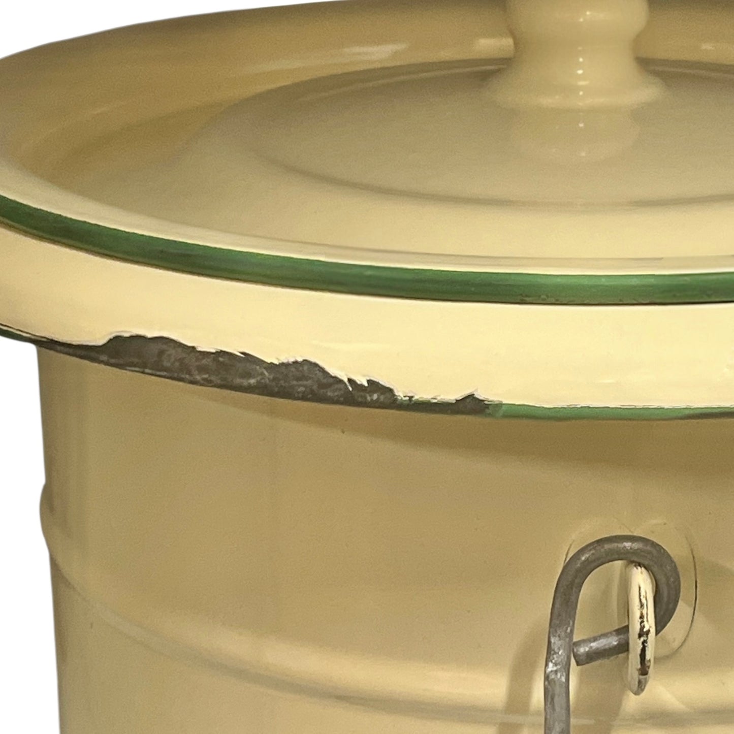 Close up of French vintage cream and green enamel bucket with a lid and handle on a white background