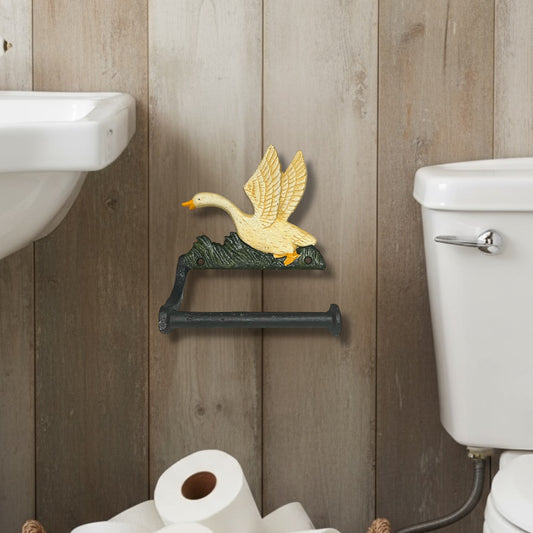 Decorative toilet paper holder with a goose design on a wall in a bathroom next to a toilet and a sink