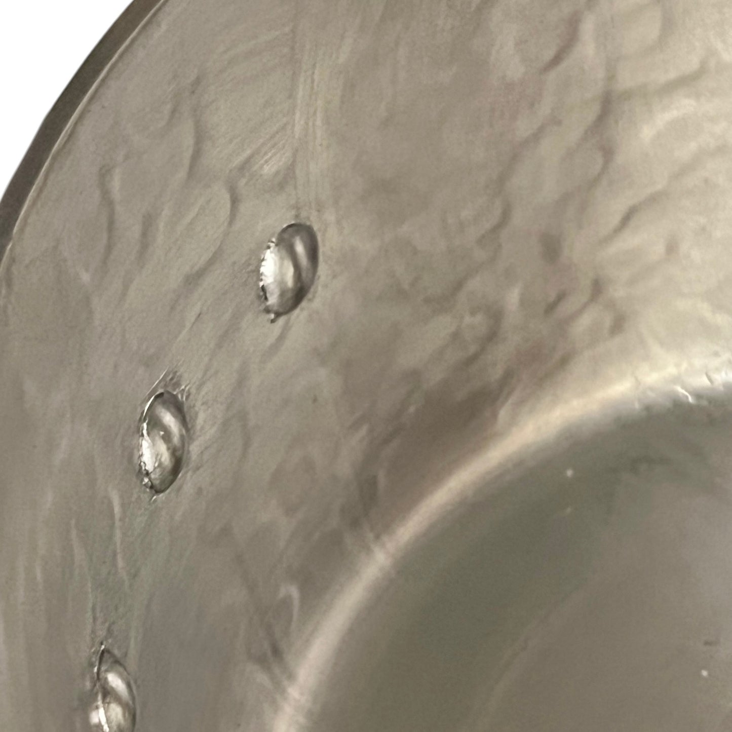 inside tin lining of copper saucepan