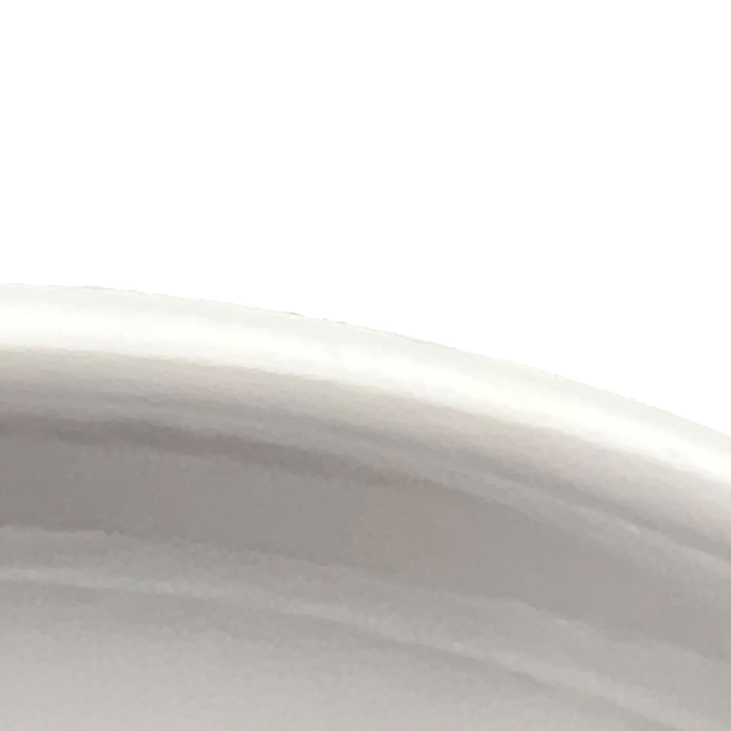 Close-up of a white ceramic bowl with a smooth surface