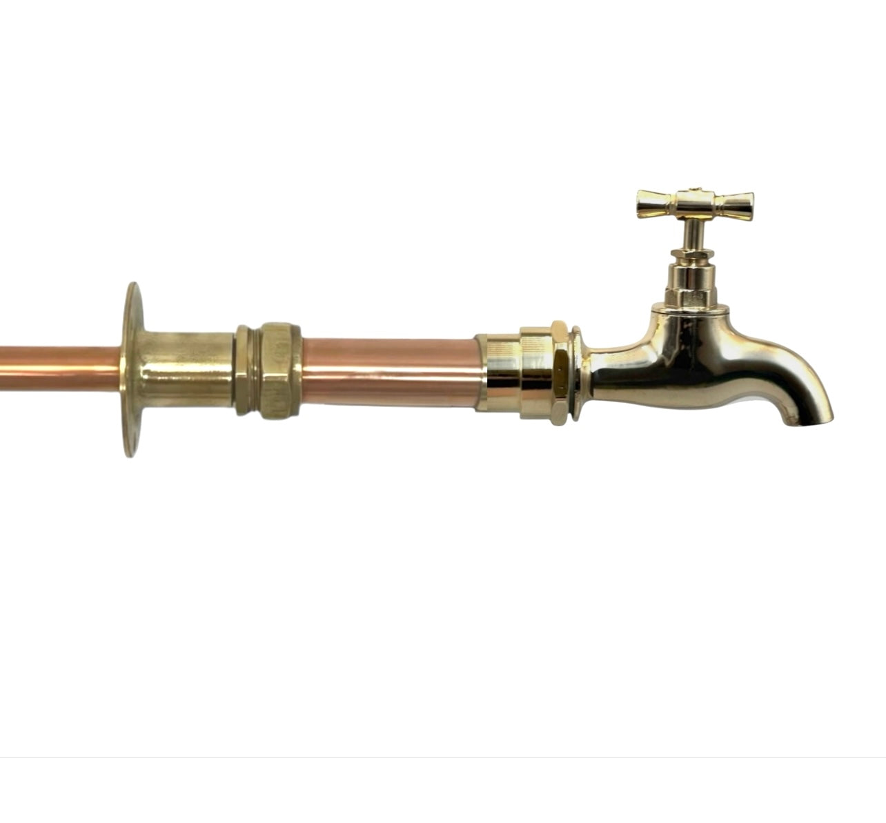 A vintage style copper and brass wall mounted kitchen or bathroom tap
