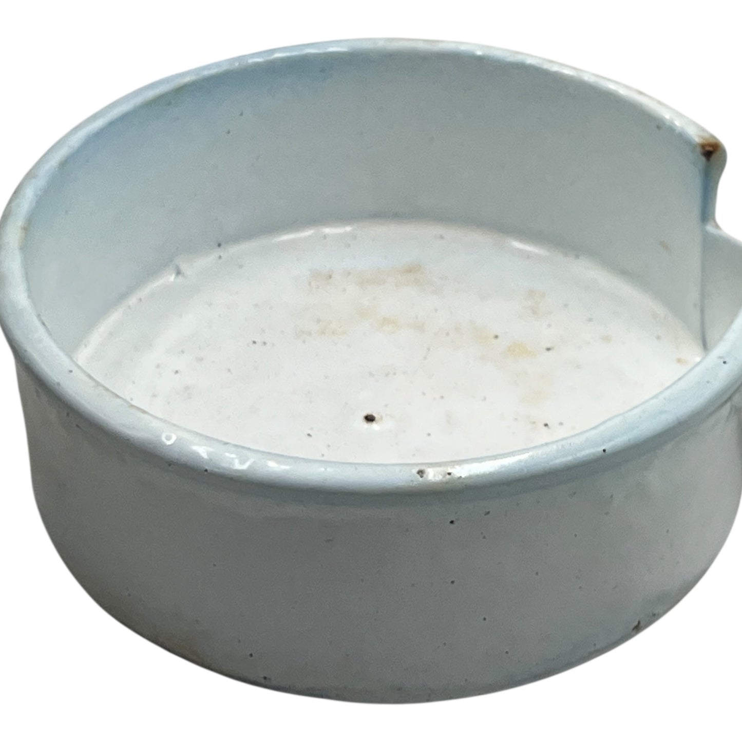 Close-up of a vintage French fruit press with an enamel pot on a white background