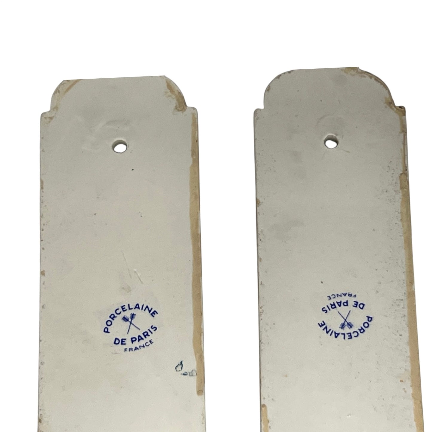 close up of door push plate with a Paris makers stamp on a white background