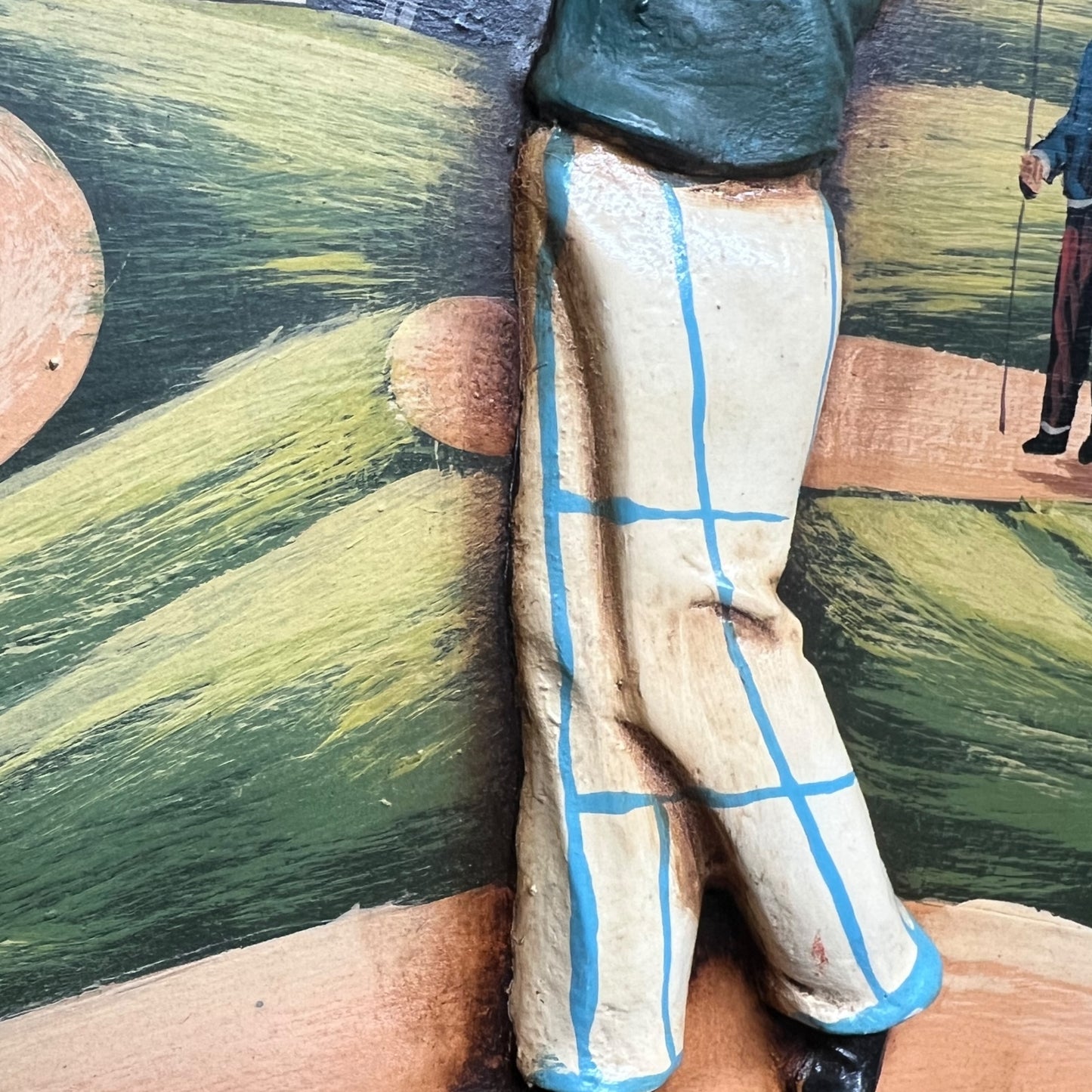 Close-up of a picture of a person wearing checkered pants with a blurred background