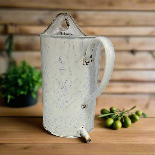 Vintage French blue and white enamel irrigator or garden planter with a tall flat back, front handle and a spout for sale from All Things French Store