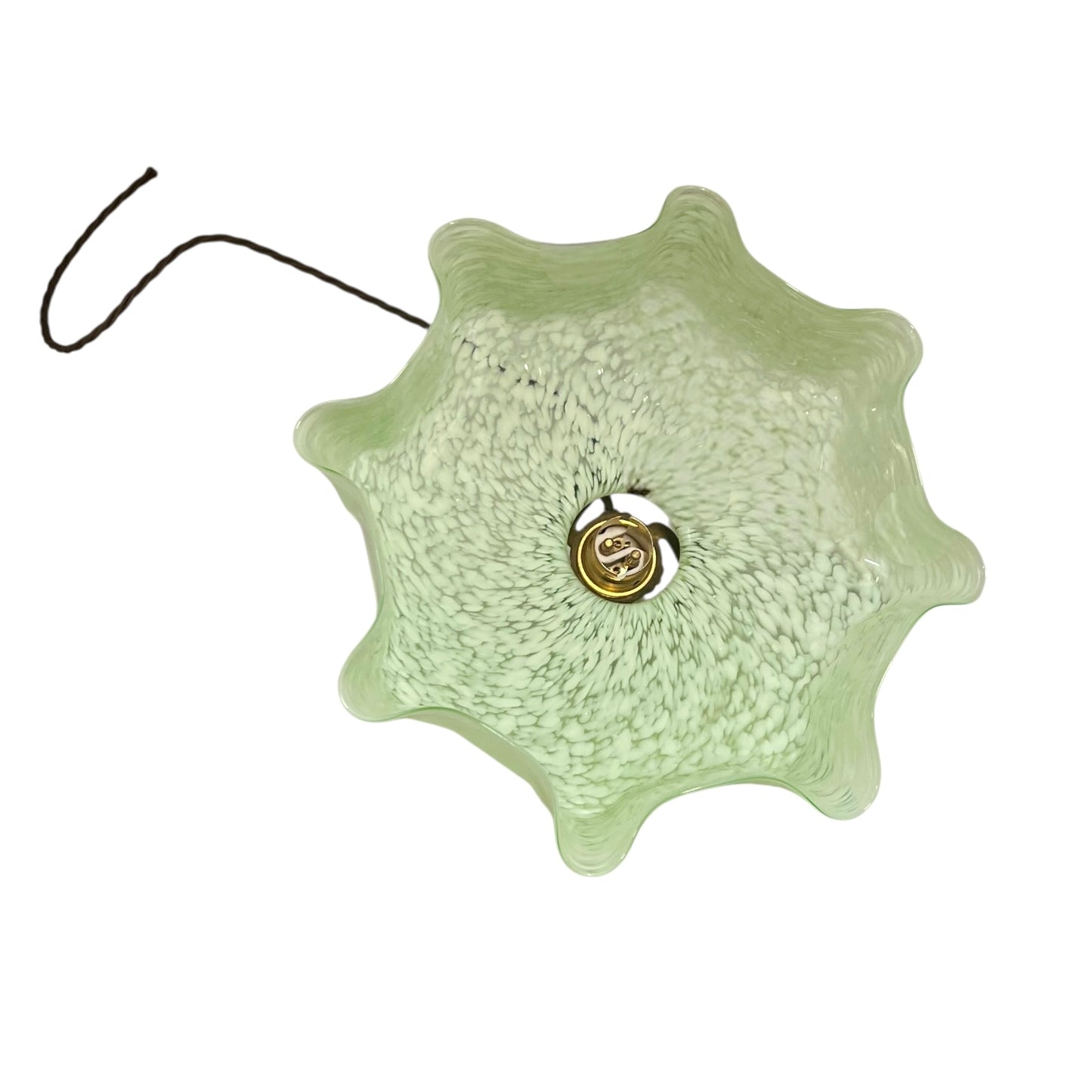 Decorative green lamp shade with a gold centre on a white background