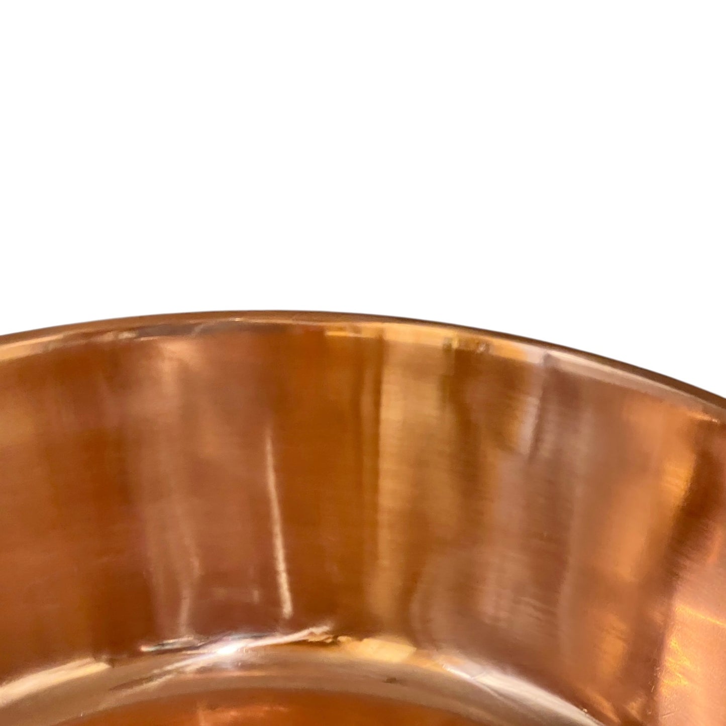 Close up of a copper basin sink on a white background