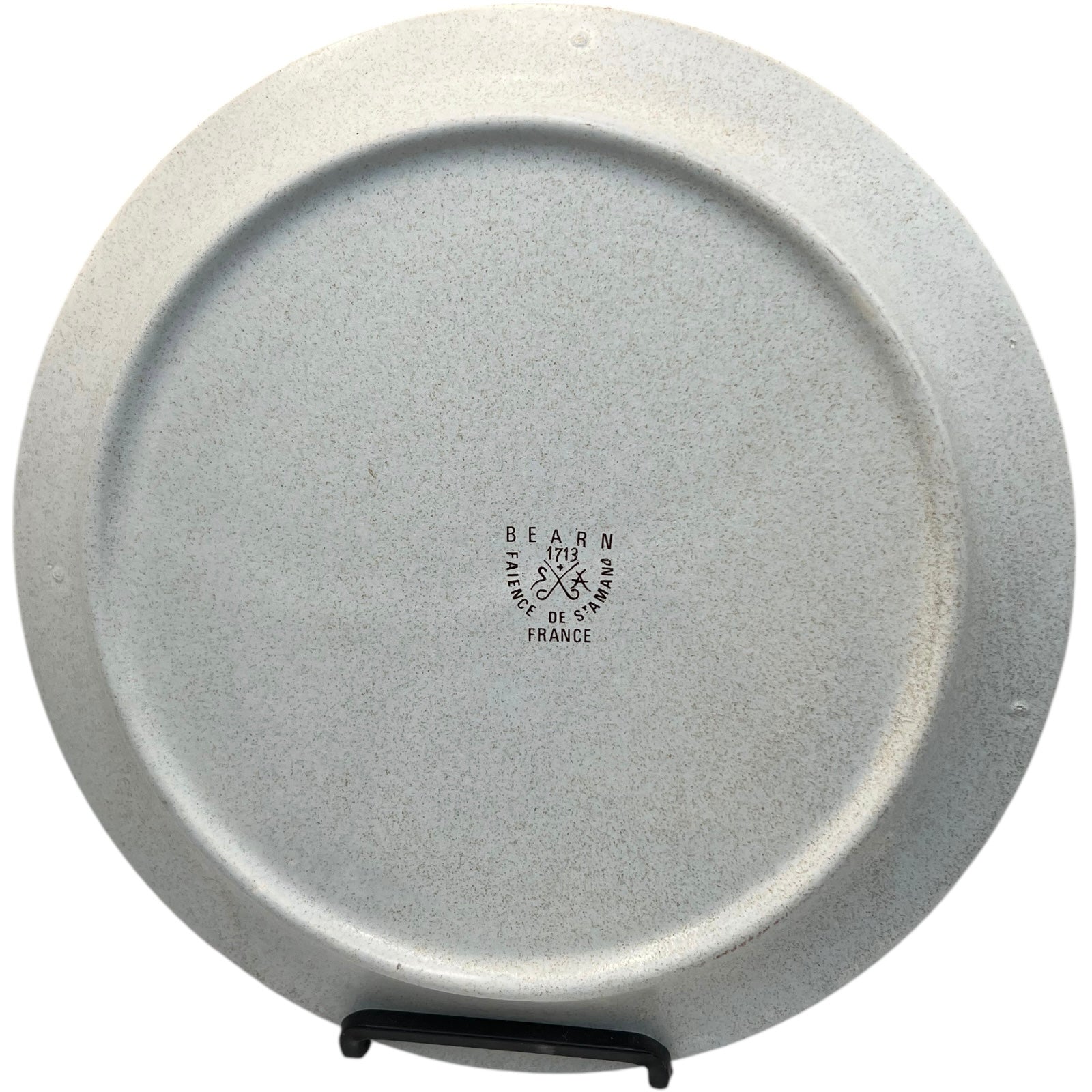 French retro style divided fondue plate rear view showing the makers stamp and model number. Made by St Armand and displayed on a white background