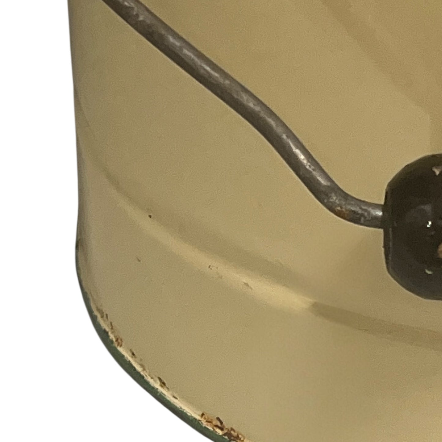 Close up of French vintage cream and green enamel bucket with a lid and handle on a white background