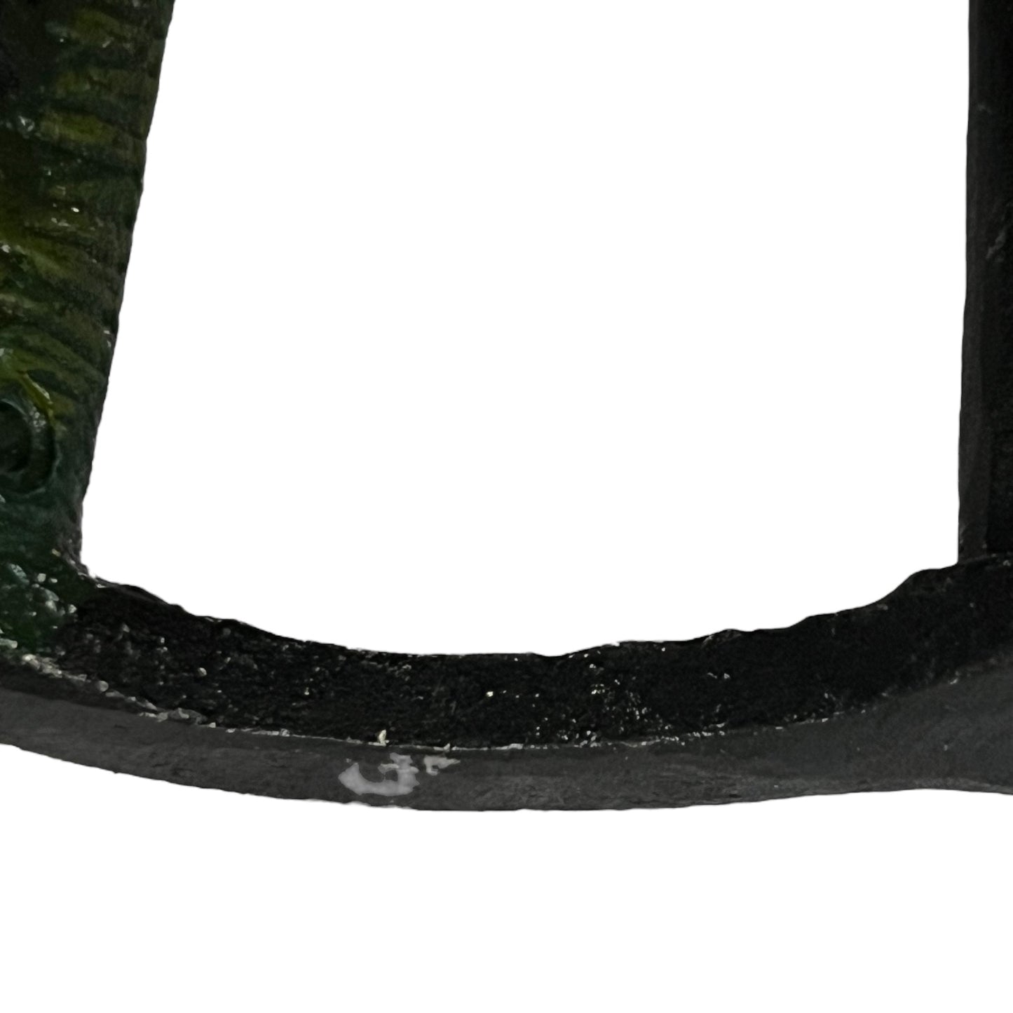 Close-up of a cow-shaped toiler paper roll holder on a white background