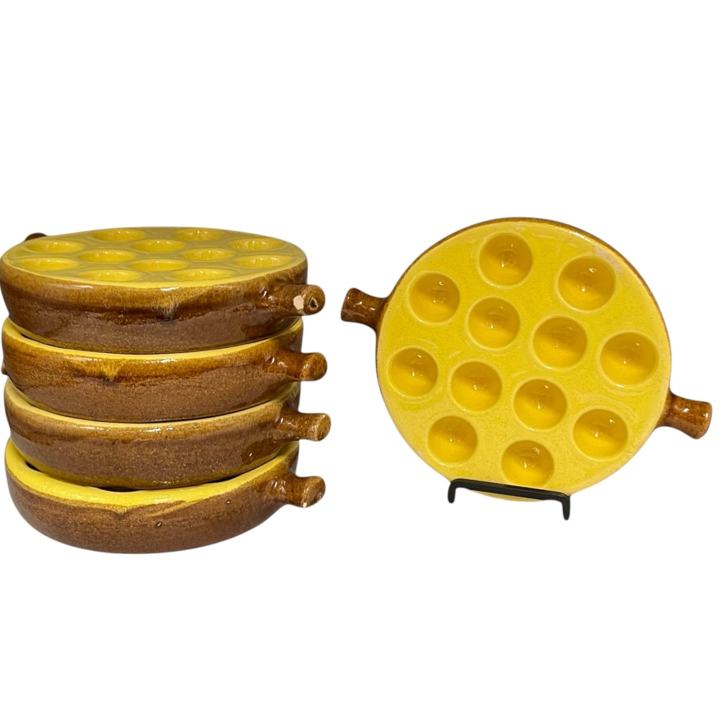 A set of 5 vintage French ceramic escargot dishes, with a pale brown body and a yellow top, featuring multiple compartments for serving snails.