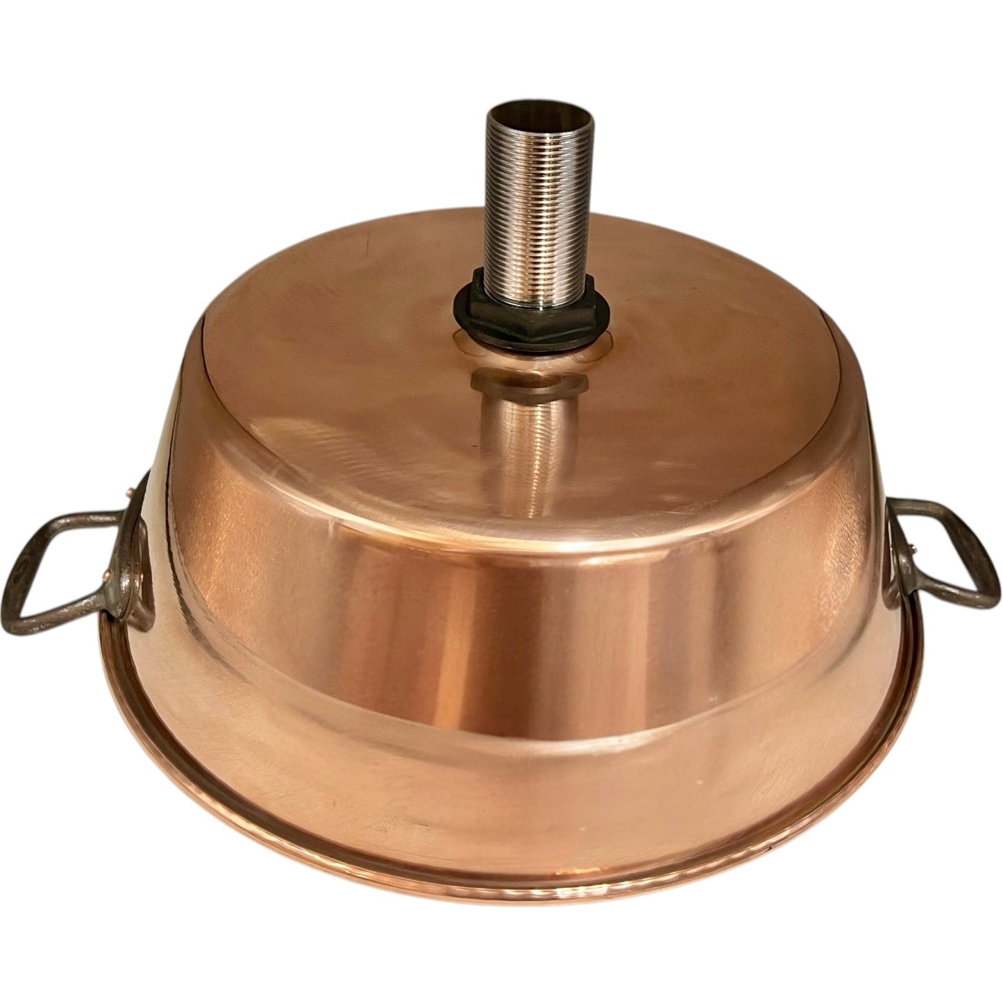 Close up of French copper bowl upcycled into a copper sink with cast iron handles on a white background