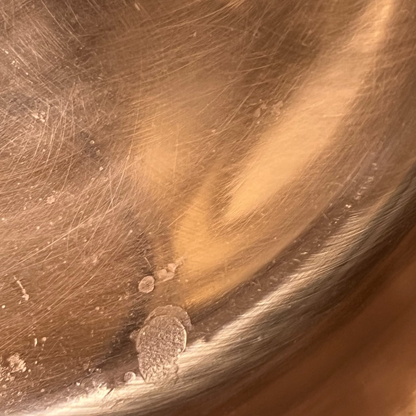 Close up of a copper basin sink on a white background
