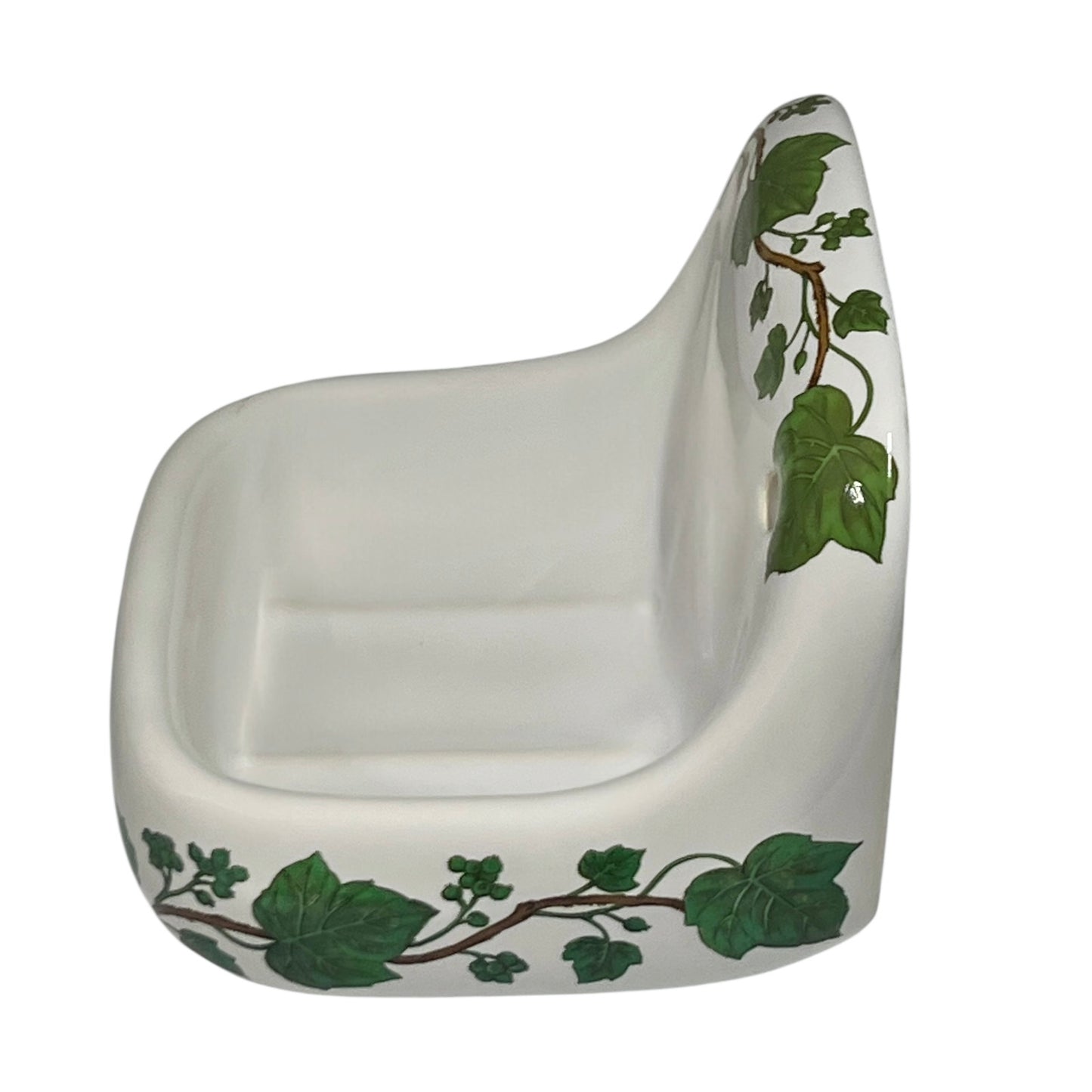 Porcelain bathroom soap dish featuring green leaf patterns on a white background