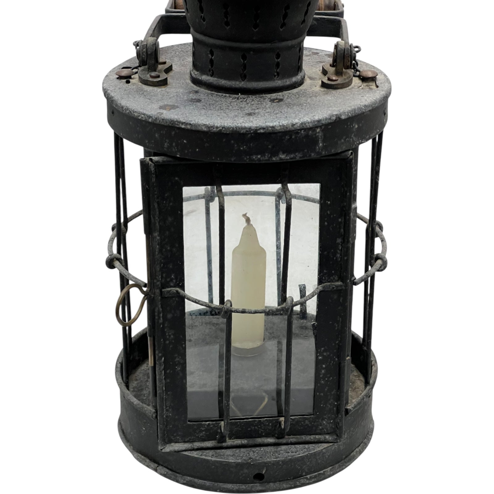 Vintage black lantern with glass cover on a white background