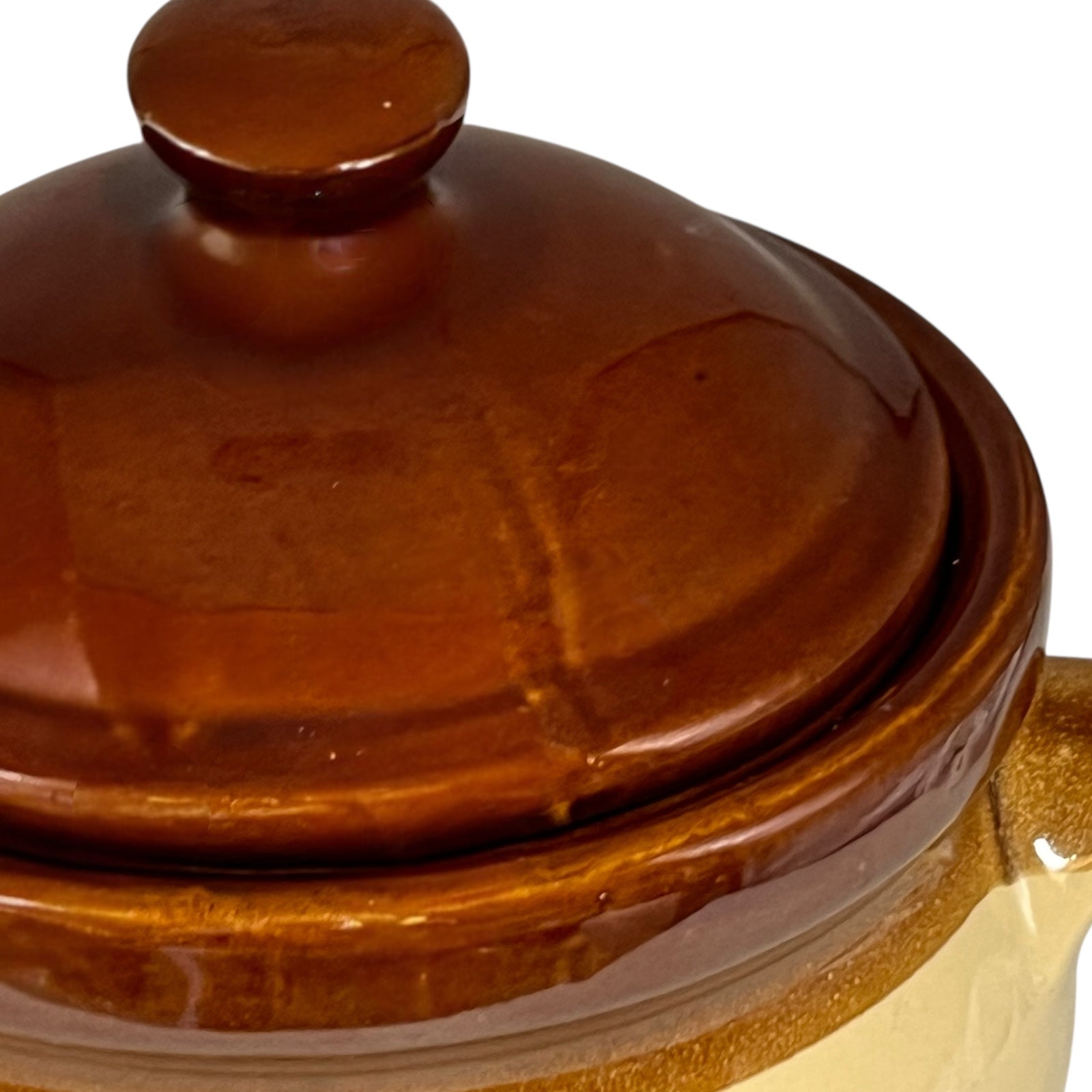 Close-up of a ceramic soup bowl with 'Soupe a L'Oignon' text on a white background