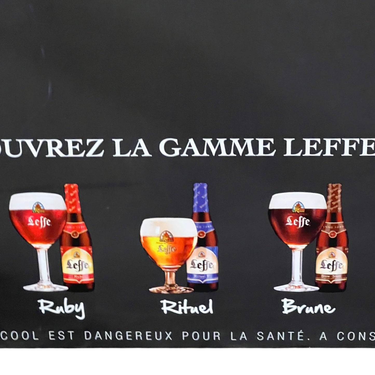 Promotional image of Leffe beer bottles and glasses on a black background with text.