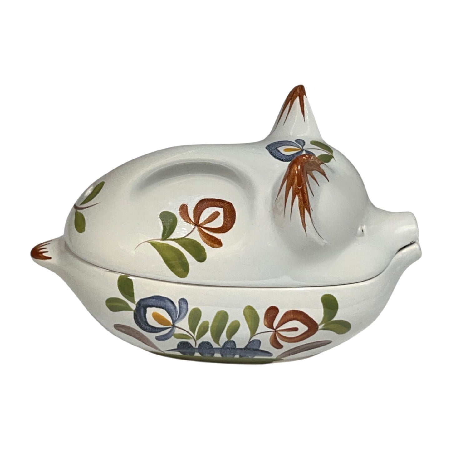 Ceramic pig-shaped container with floral designs and 'Rillettes' text on a white background