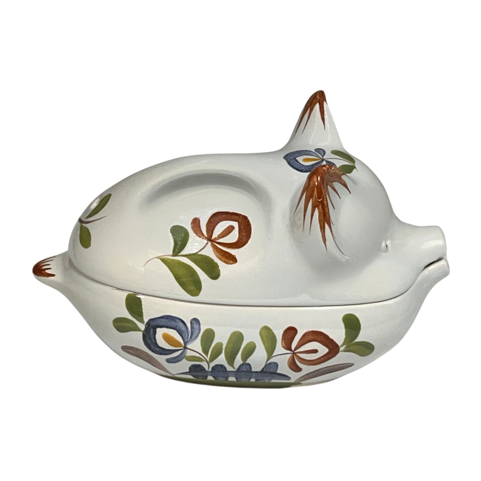 Ceramic pig-shaped container with floral designs and 'Rillettes' text on a white background