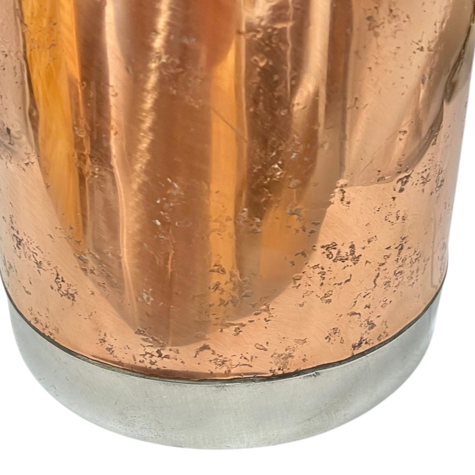 Close-up of a copper milk churn with a chain handle on a white background