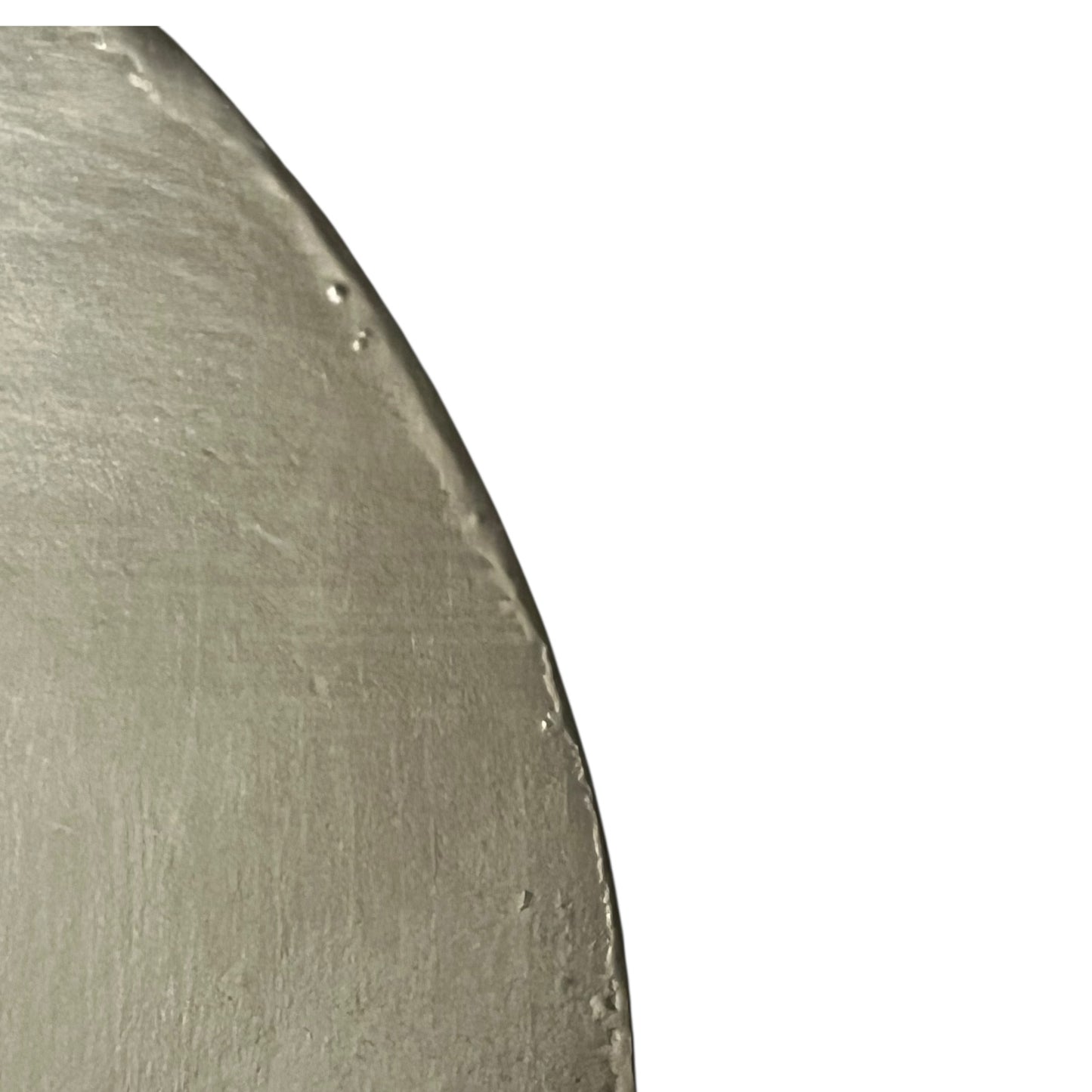 Close-up of a copper pan lid with brand new tin lining on a white background
