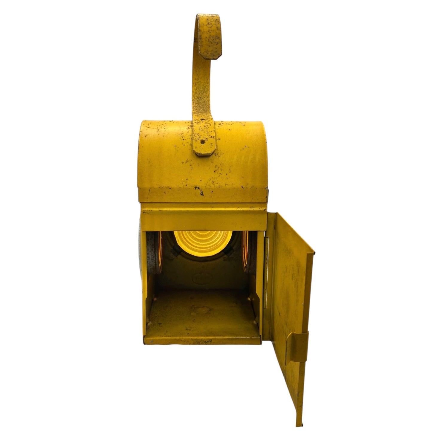 Close up of yellow vintage railway or railroad lamp with orange glass panels and a hook on a white background