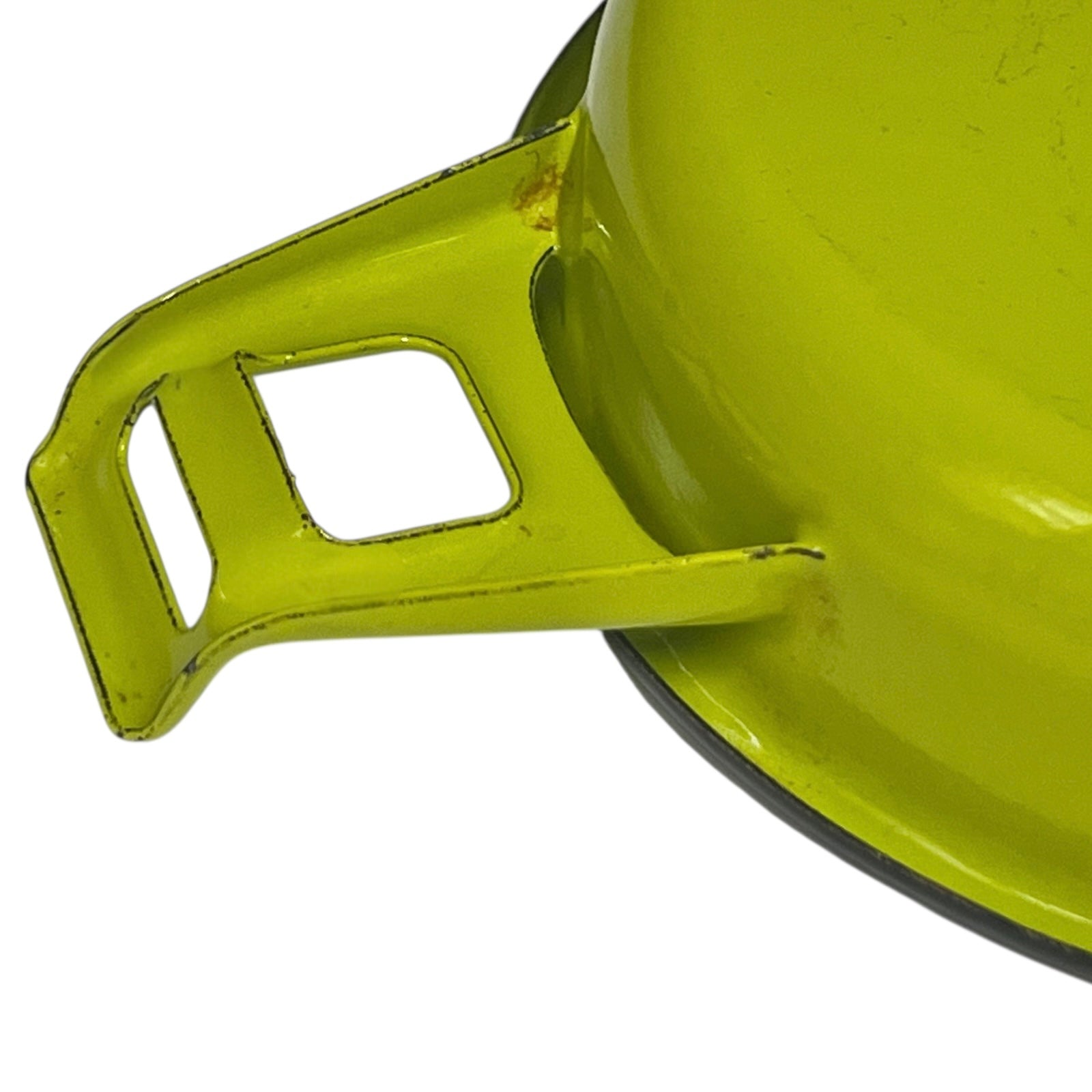 Green frying pan with a white interior on a white background