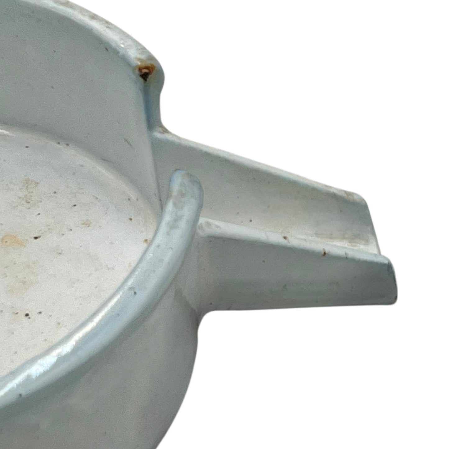 Close-up of a vintage French fruit press with an enamel pot on a white background