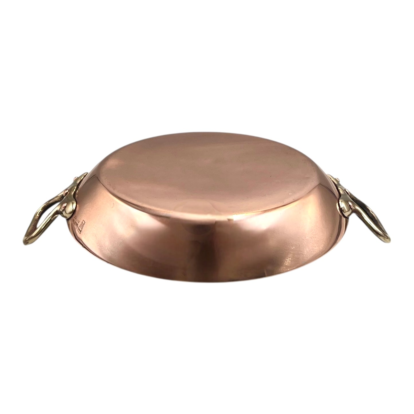 French copper round gratin pan with brass handles on a white background for sale from All Things French Store