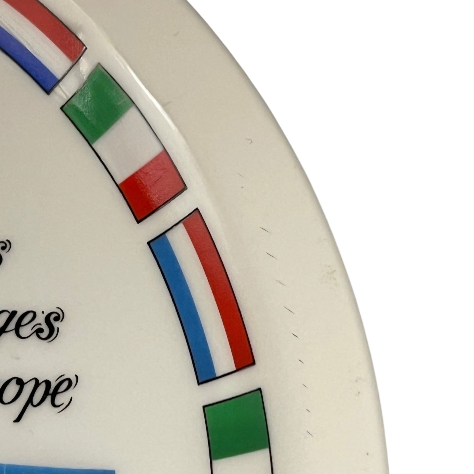 Close-up of a decorative cheeseboard with a flag design on a white background