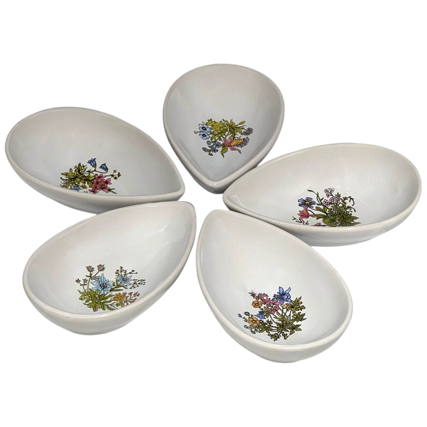 Set of ceramic avocado bowls with floral patterns on a white background