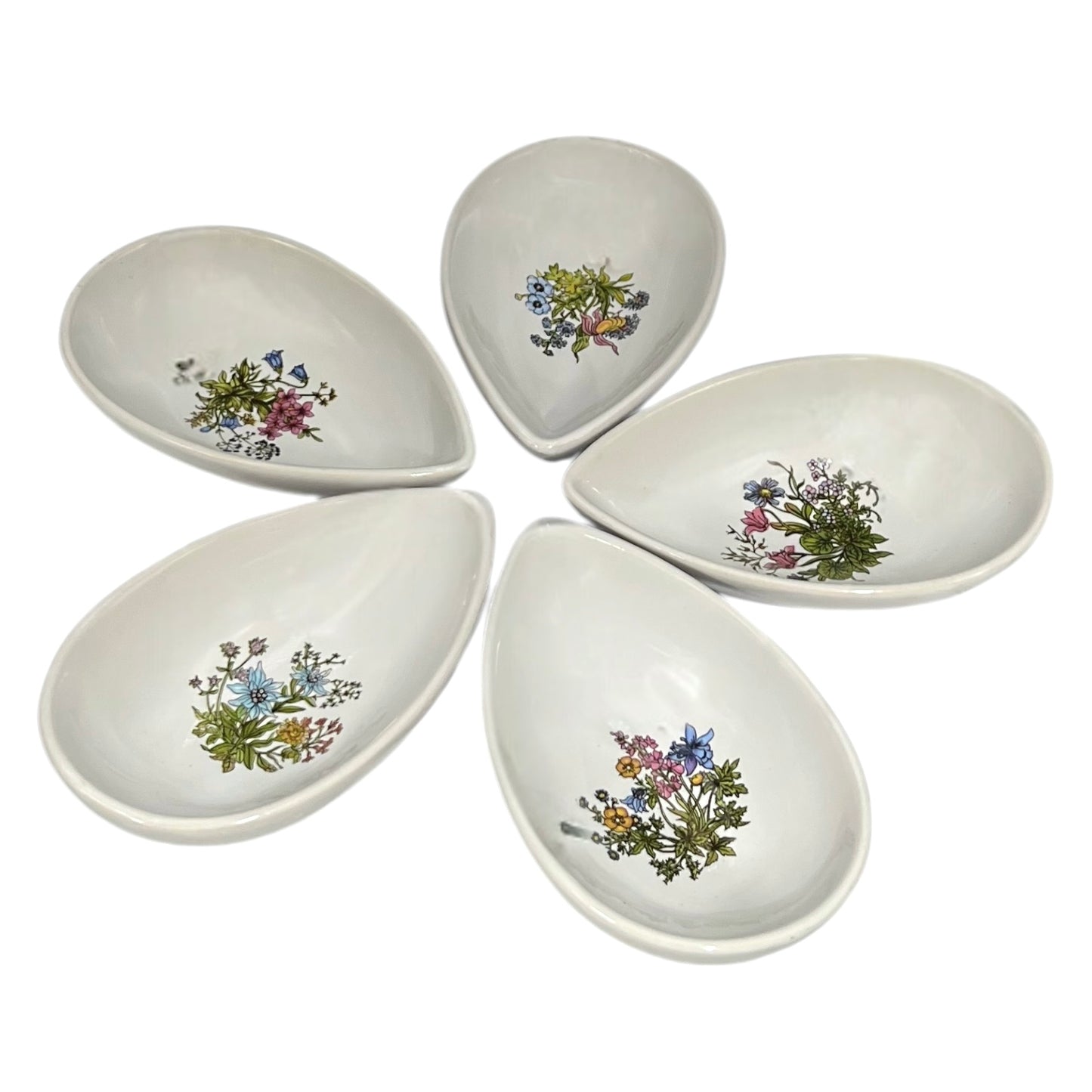 Set of ceramic avocado bowls with floral patterns on a white background