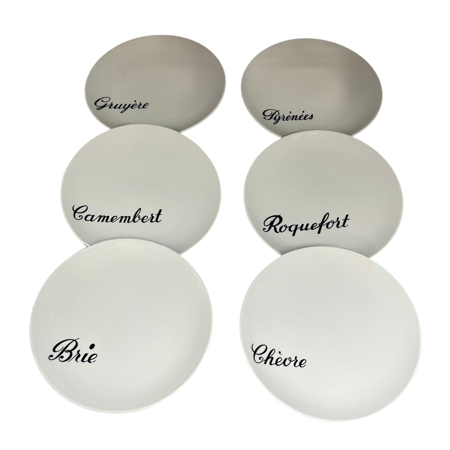Set of white cheese plates with black text on a white background