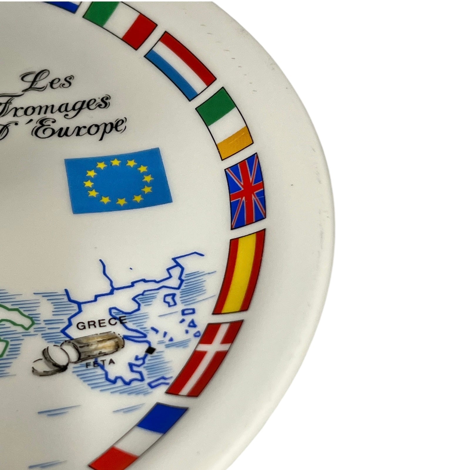 Decorative cheeseboard with European flags and map, featuring the text 'Les Fromages d'Europe'.