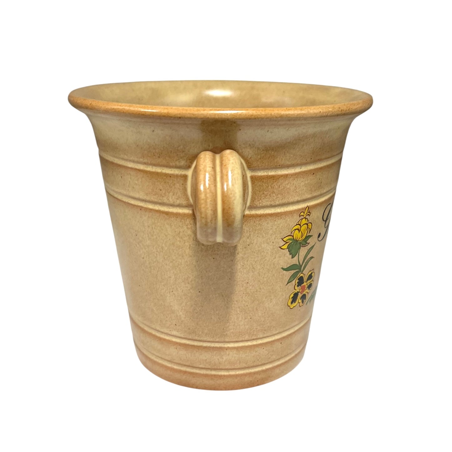 Ceramic cup with handle and floral design on a white background