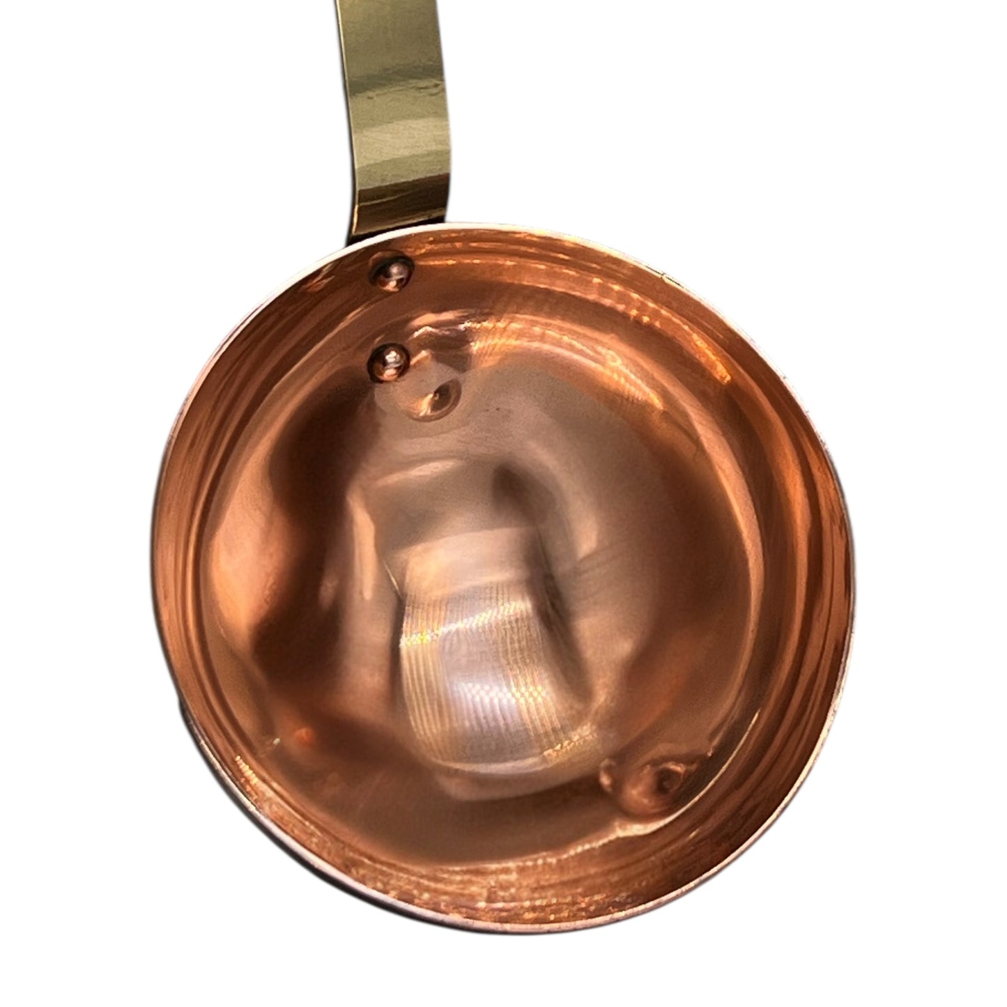 French copper ladle with a brass handle on a white background
