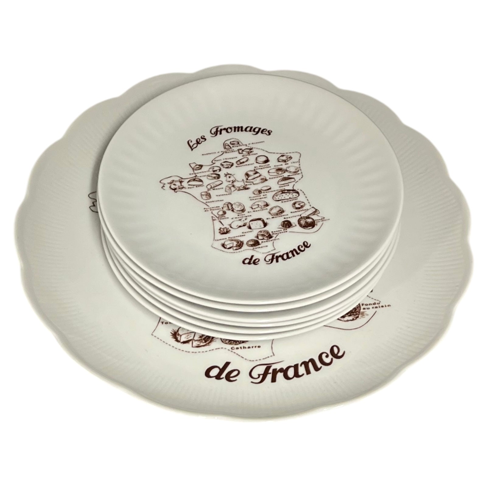 Set of white plates with 'Les Fromages de France' design on a white background