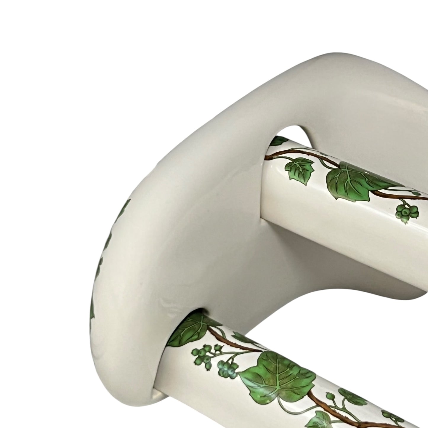 White and green leaf patterned towel rails and brackets on a white background