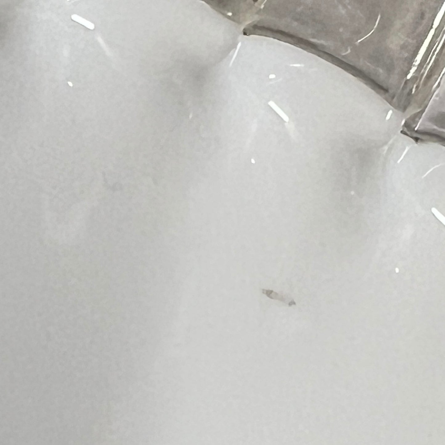 close up of lampshade rim on a white background