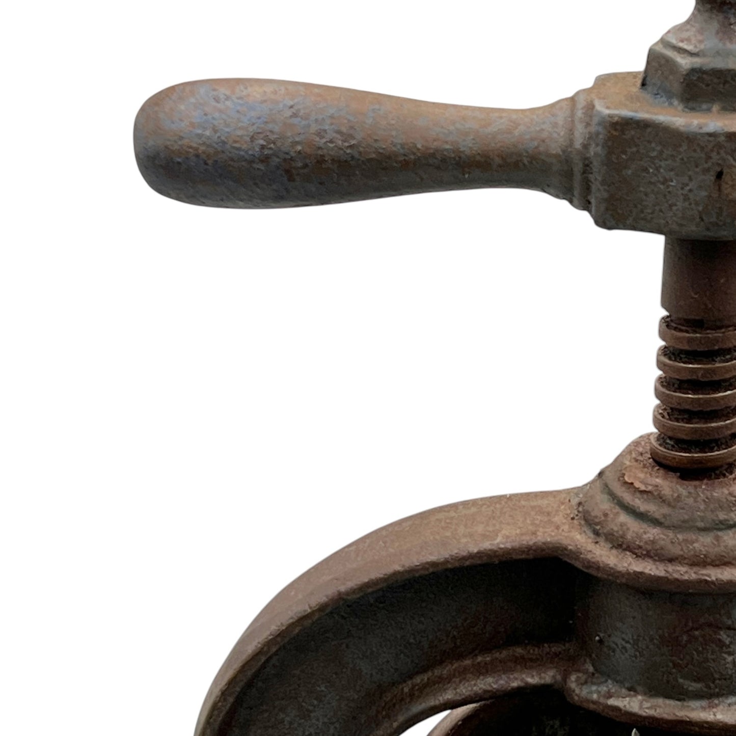 Close-up of a rusty metal clamp on a white background
