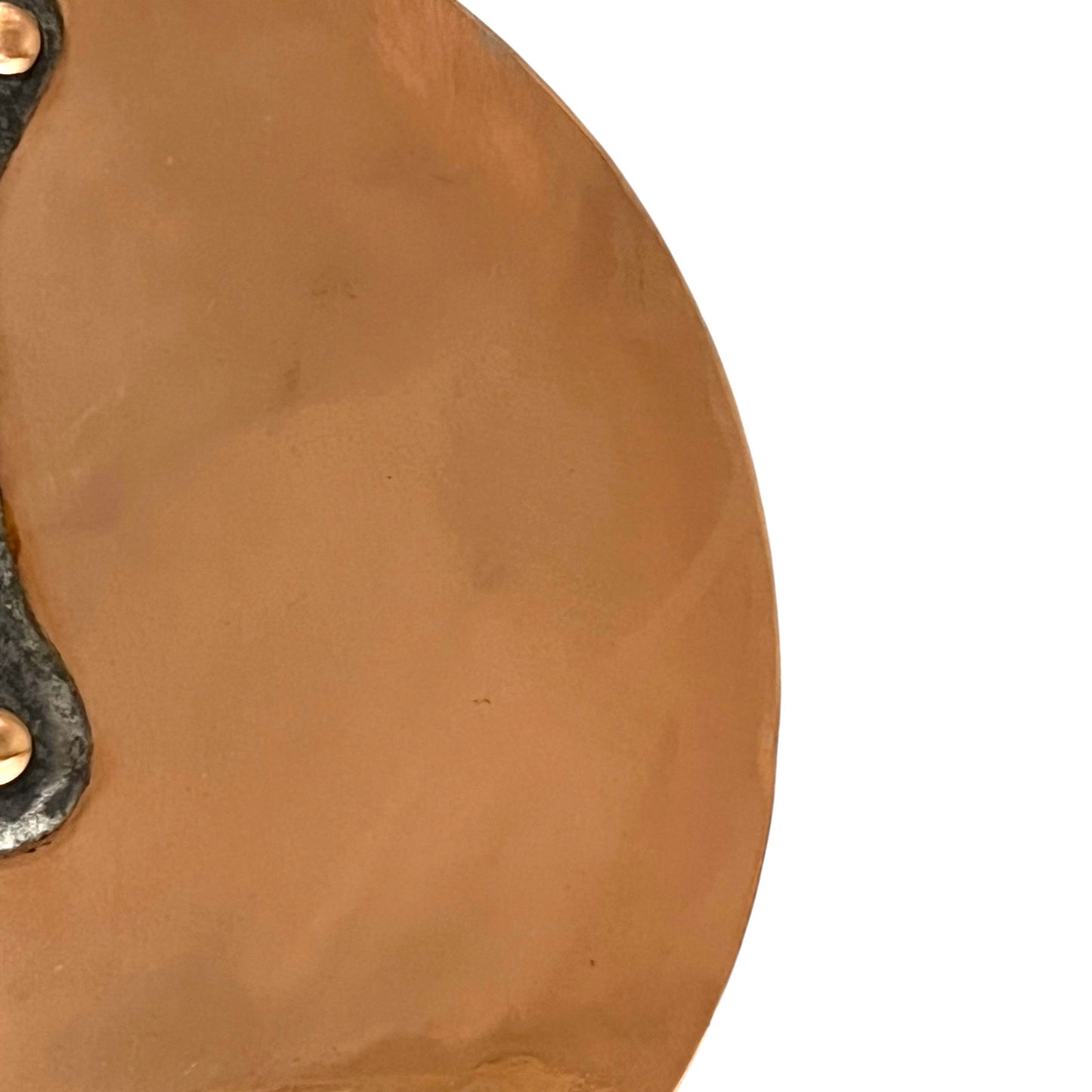 Close-up of a copper pan lid on a white background