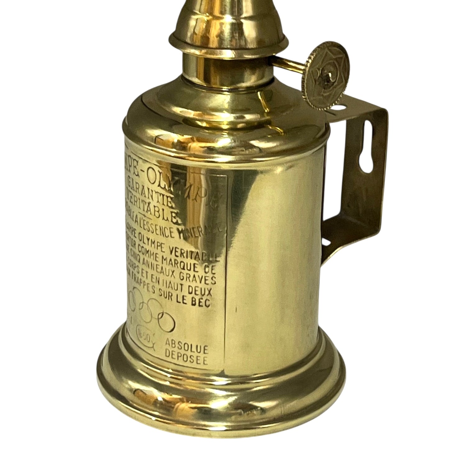 Brass lamp with engraved text on a white background