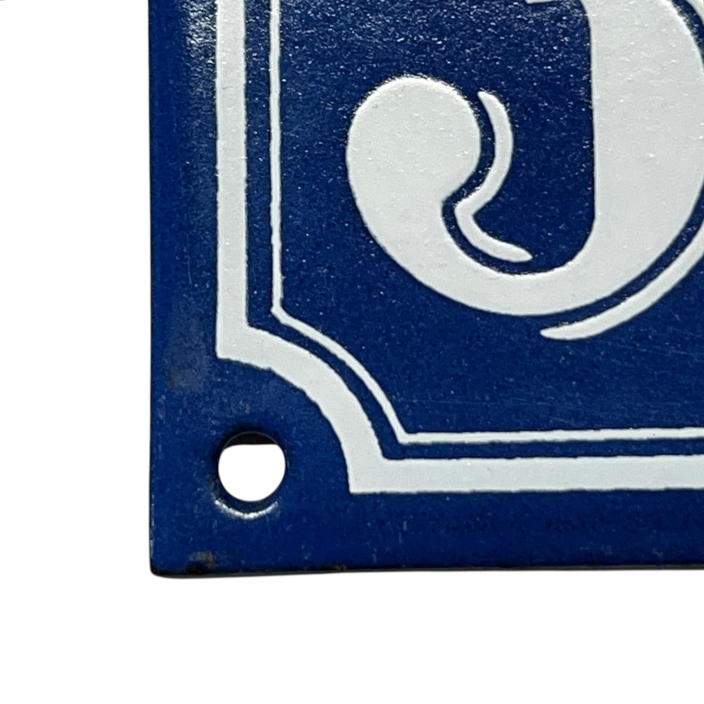 corner of enamel door number